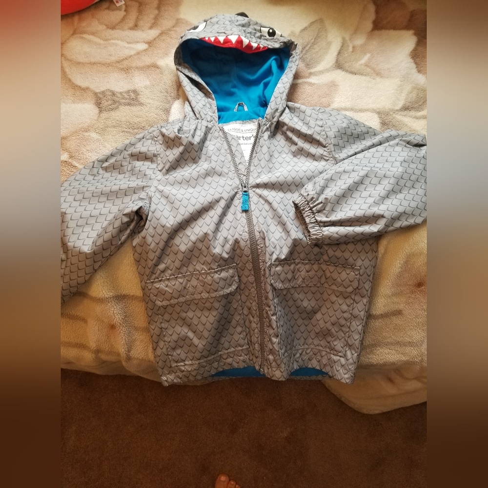 Children's raincoat. Size 8 Brand new.
